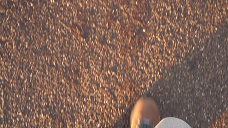 slow motion pov unrecognisable man-woman walking in brown hiking boots with shadow cast