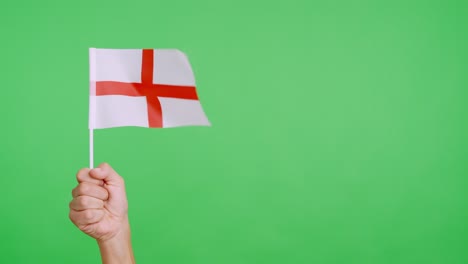 Wind waving a english pennant holding by a person