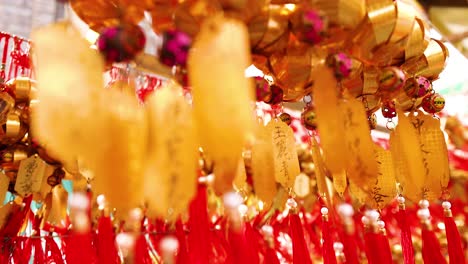 hanging golden bells with red tassels in temple