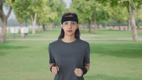 serious indian girl doing jogging