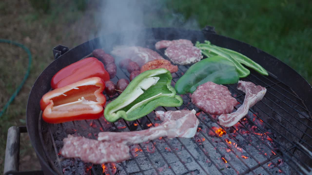 Delicious Grilled Meats and Vegetables on a Charcoal Grill