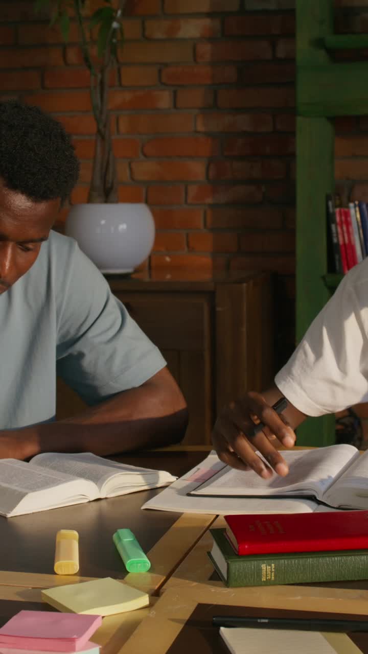 Two Men Studying