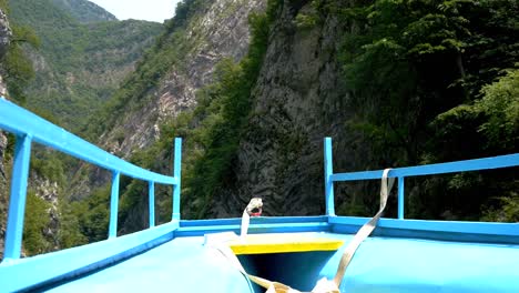 Albania,-Lake-Koman,-view-from-inside-the-ferry-of-the-rocky-slopes-of-the-mountains