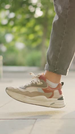 close-up of a person walking in colorful sneakers