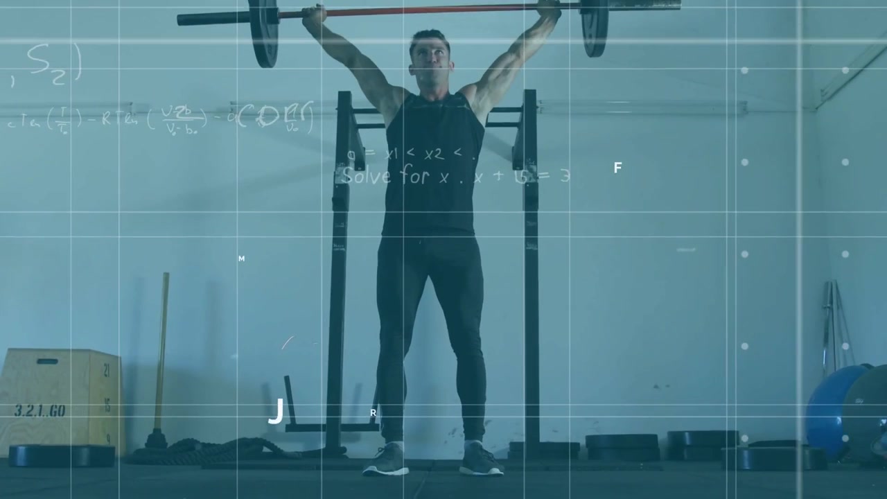 Mid-adult man entering garage gripping barbell on squat rack, doing overhead squat for strength