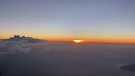 dawn from a plane doing a left turn