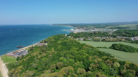 Aerial-landscape-of-the-coast-line-of-the-Isle-of-Wight-with-a-bright-blue-sea-on-a-bright-sunny-day