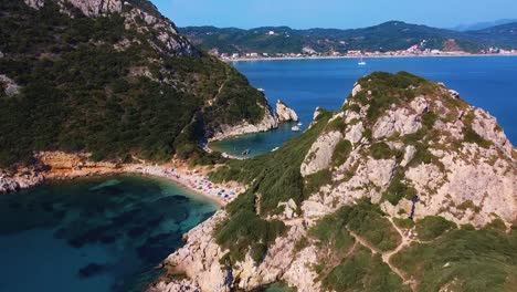 Aerial-shot-of-wild-beach-with-sunbathing-people