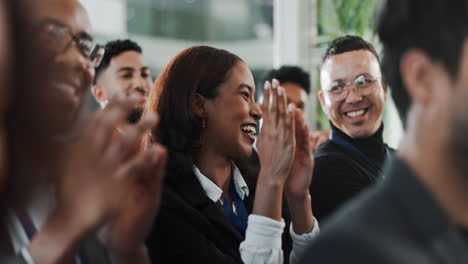 diverse group of people applauding at a business event.