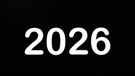 close up del 2026 che viene digitato sullo schermo del monitor del computer con il cursore lampeggiante su sfondo nero spazio di copia