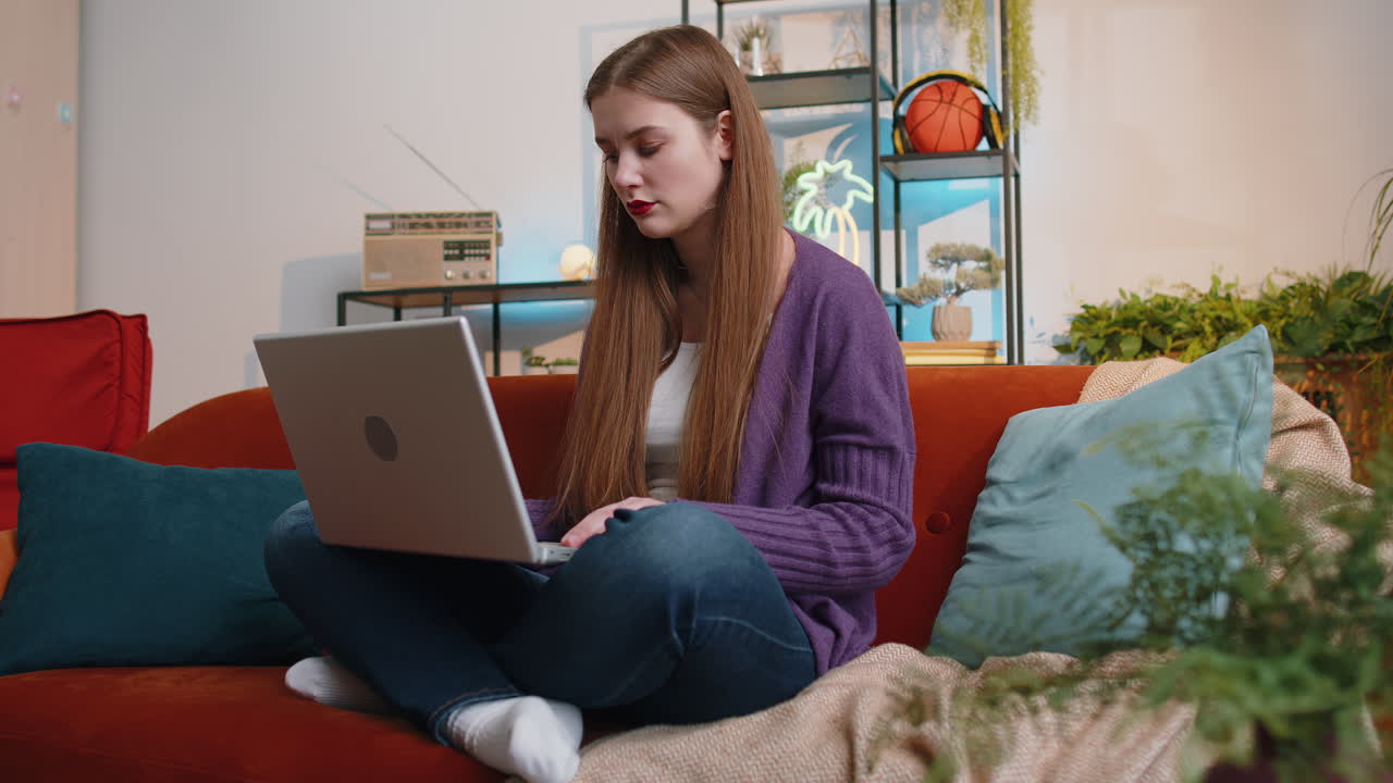 Pretty young woman use laptop surprised by bad news fortune loss fail lottery results at home