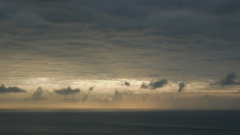 dramatic time lapse captures dark dusky sky moving above sea horizon