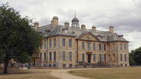 a huge mansion on a wealthy estate in the english countryside