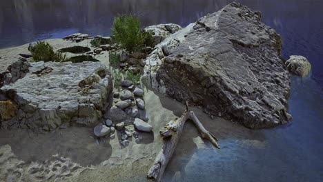 beautiful rocky shoreline with vegetation and calm water at sunset