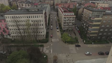 A-street-with-parked-cars-and-old-buildings-in-Eastern-Europe