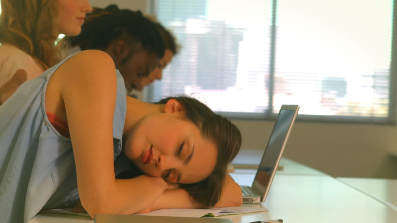 Students taking notes in lecture
