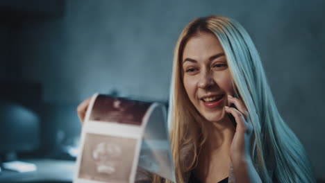 cheerful lady shares news about healthy pregnancy at call