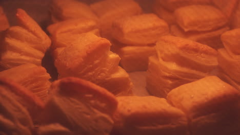 Puff-pastry-scones-baking-in-oven-in-home-kitchen,-selective-focus