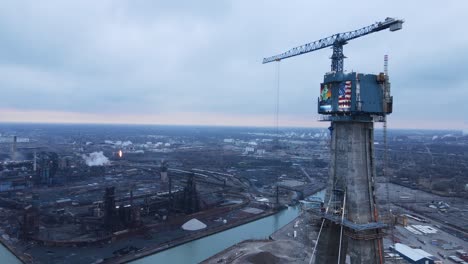 engineers building massive concrete pillar for gordie howe bridge, aerial view