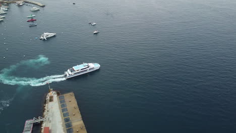 Aerial-View-of-Santa-Catalina-Passenger-Cruise-Ship-and-Amazing-Scenery-of-Avalon-Harbor,-Wide-Orbit