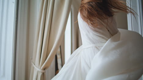 Dancing-lady-swirling-home-closeup.-Happy-woman-spinning-alone-at-morning-house