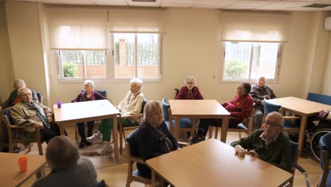 old people gathering in lounge of retirement home