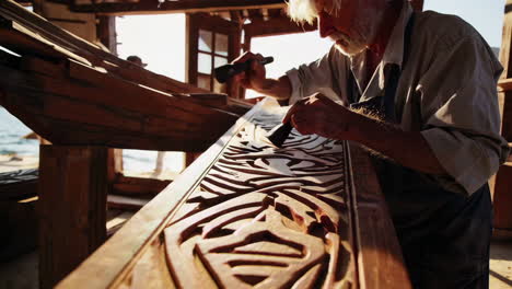senior woodcarver at work