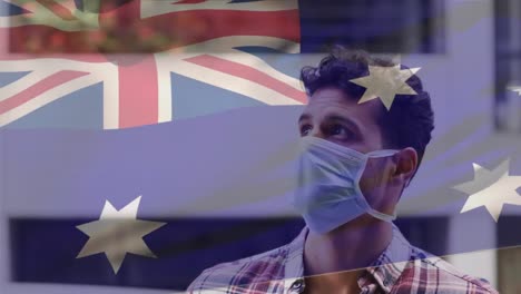Animation-of-flag-of-australia-waving-over-latin-man-wearing-face-mask-in-city-street