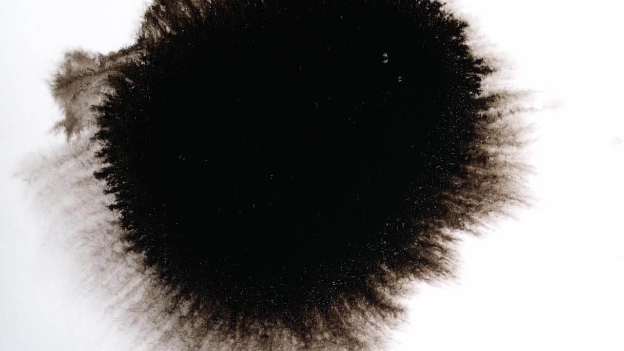 Black Ink Drops On White Background