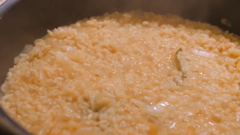 close up view of delicious risotto in the frying pan