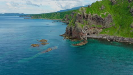 aerial drone fly at japanese sea secret natural landscape of shakotan, hokkaido