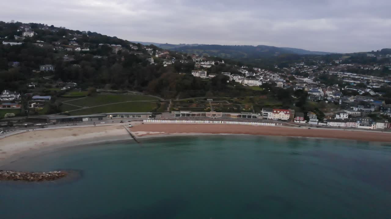 Aerial View Of Sandy Beach At Lyme Regis With Town View In Background. Dolly Right
