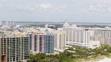 Luxury-hotels-and-apartments-of-Miami-and-sandy-coastline,-aerial-view