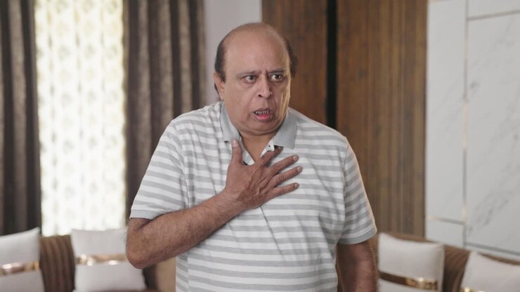 Fat Indian old man having an Asthma attack