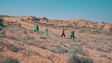 volunteers cleaning up a desert