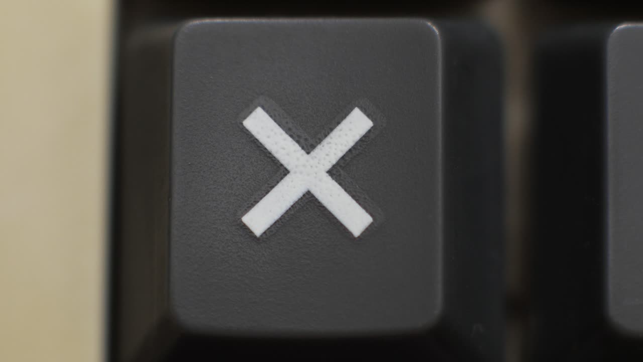 Macro close up of a multiply key being pressed, symbolizing scaling and compound growth