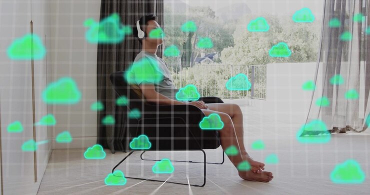 Asian male shifting placing headphones starting green cloud icons streaming over grid in tech demo