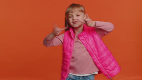 Overjoyed-happy-girl-showing-rock-n-roll-gesture-by-hands,-cool-sign,-shouting-yeah-with-crazy-face