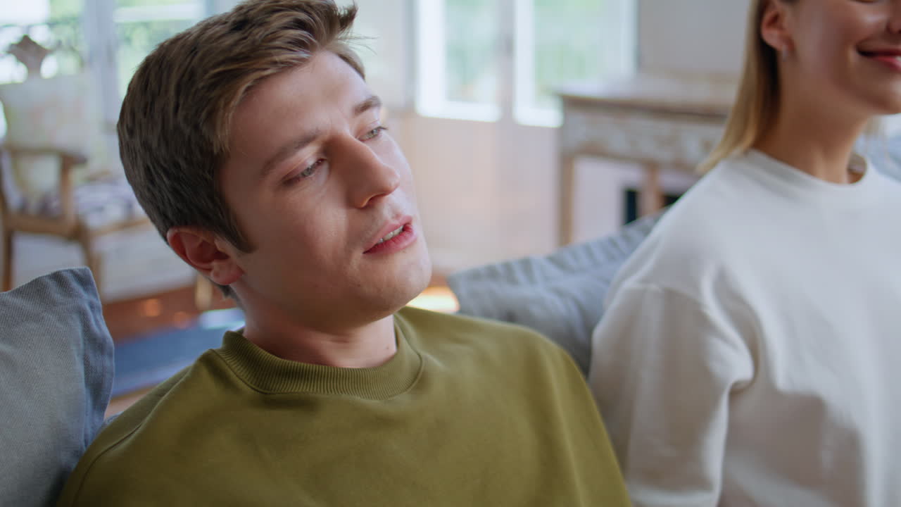 Disappointed player losing videogame at room closeup. Happy girlfriend rejoicing