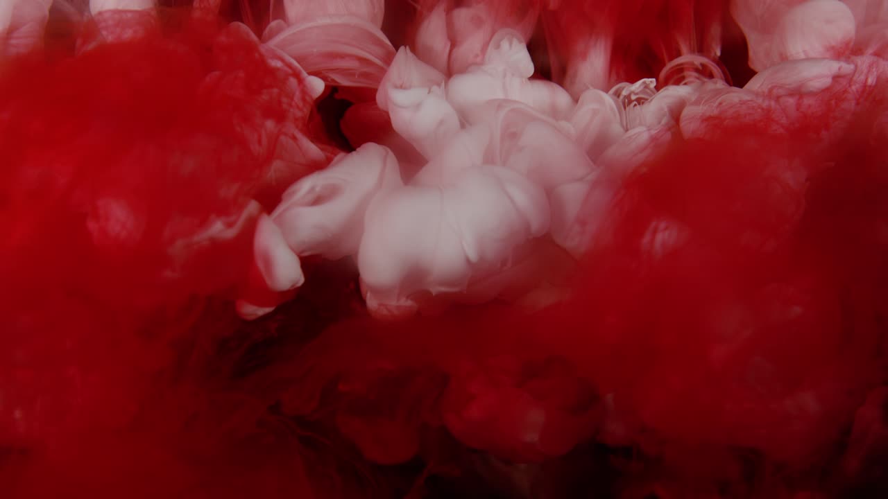 Epic color explosion under water - colors collide together in slow motion