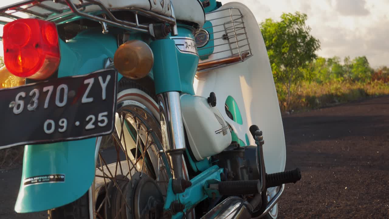Close-up Details of a Vintage Teal Honda Motorcycle