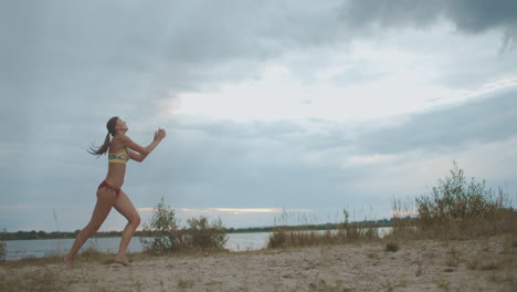 energy and power of sportswoman at volleyball match on beach slow motion shot female player is serving