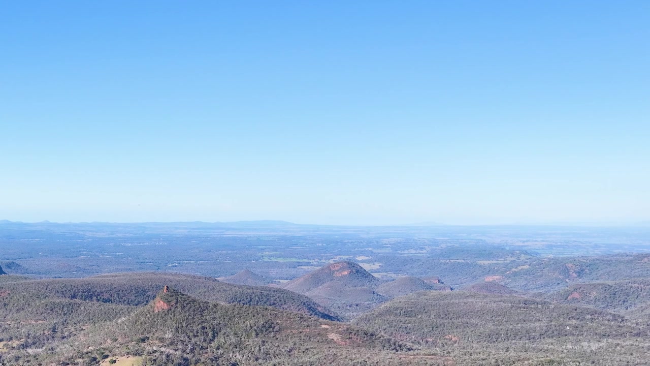 Wide panoramic shot of volcanic rock formations in Warrumbungle National Park, New South Wales, Australia.