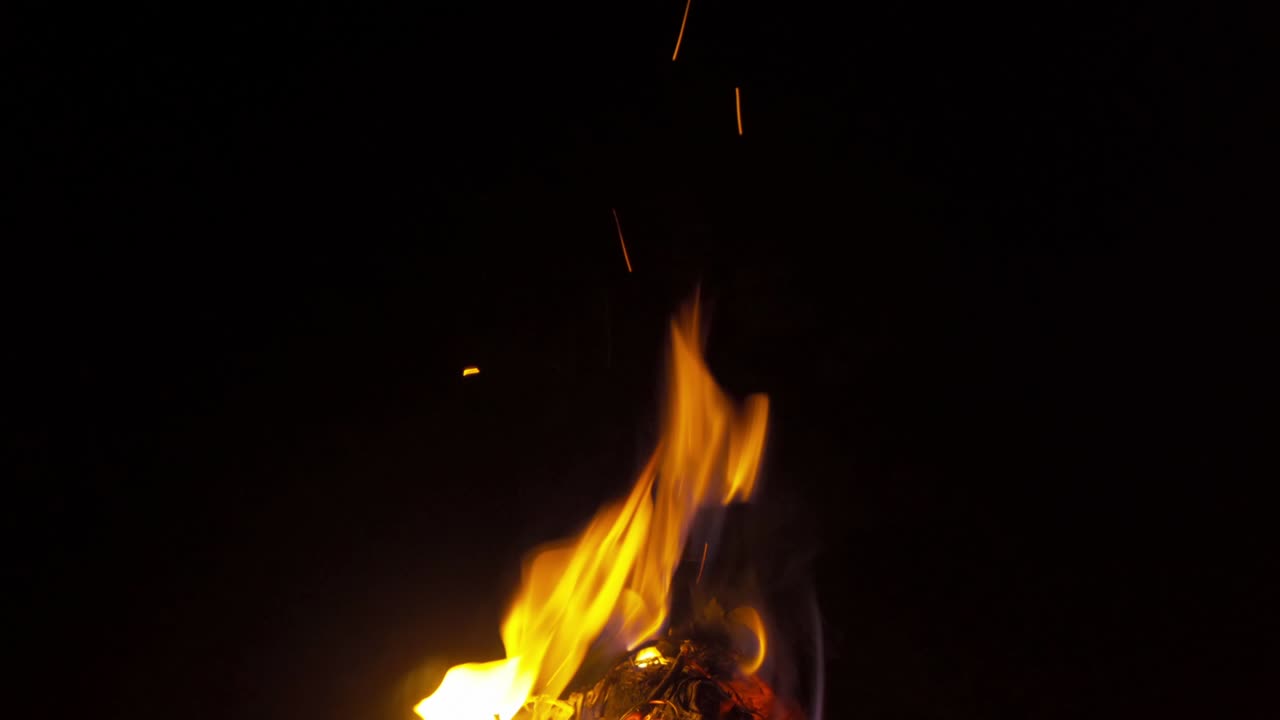 Fire in camping. Red fireplace and frame burning wood with coal in stove for giving warm, heat and smoke on black background.