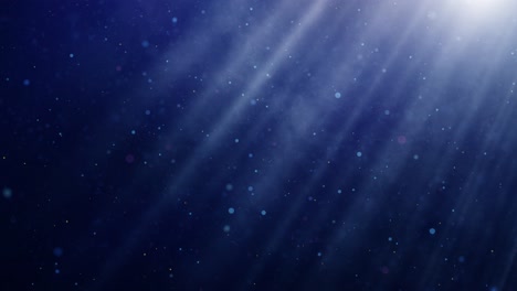 misty blue smoke and light beams - whirling particles in a soft and serene abstract atmosphere