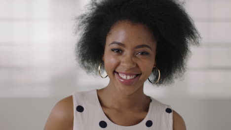 close up portrait of beautiful young african american woman laughing happy successful black female afro hairstyle