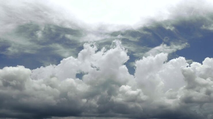 Time lapse of damatic clouds over dark blue sky