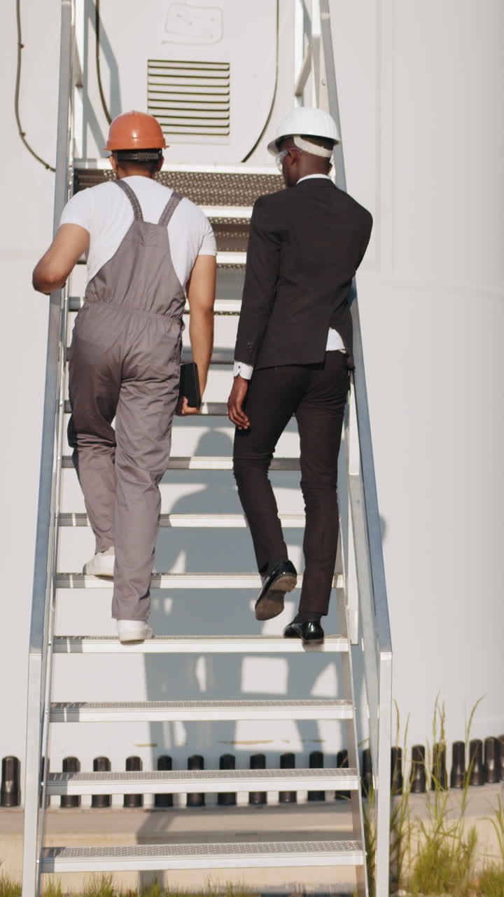 Engineers climbing stairs