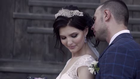 slow motion close view bride with tiara in fiance hugs