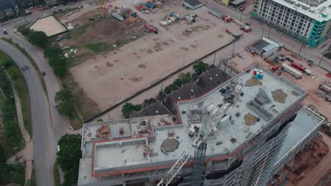 Aerial-over-building-being-constructed-in-Houston,-Texas